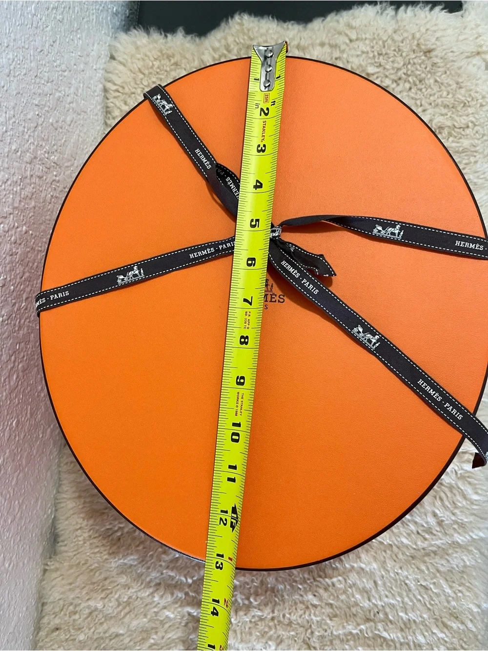Original Hermès Orange Round Hat Box with branded brown ribbon